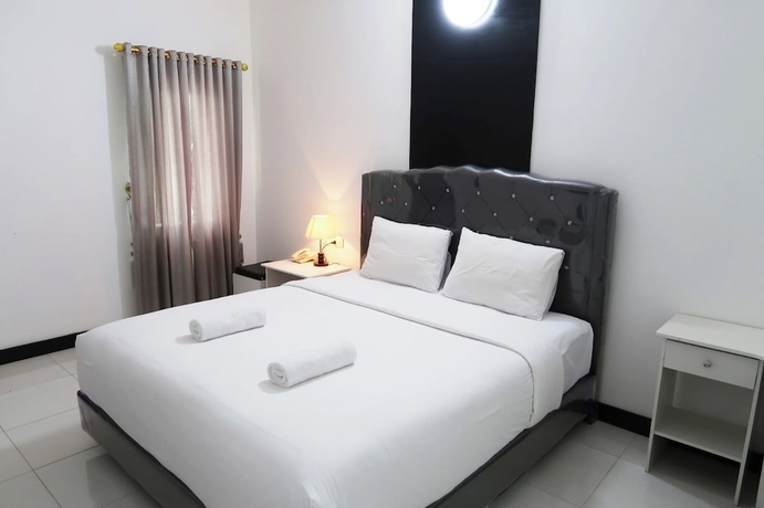 Imagen de la habitación del Hotel G Syariah Bandar Lampung. Foto 11