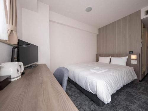 Imagen de la habitación del Hotel GARDENS STAY. Foto 17