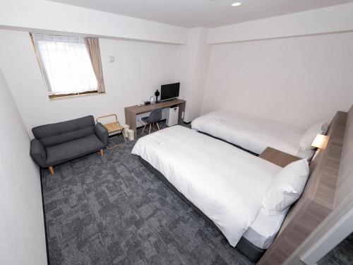 Imagen de la habitación del Hotel GARDENS STAY. Foto 18