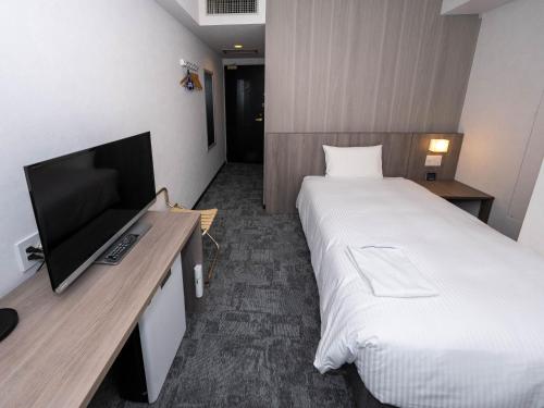 Imagen de la habitación del Hotel GARDENS STAY. Foto 19
