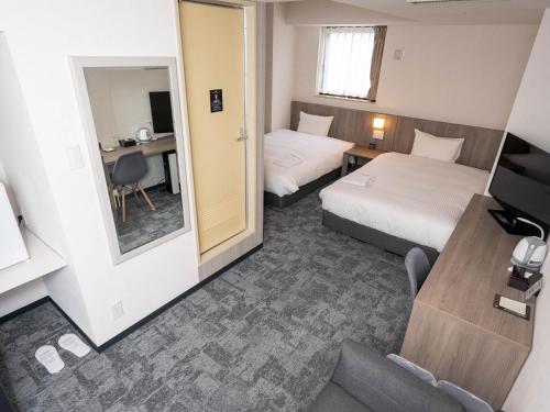 Imagen de la habitación del Hotel GARDENS STAY. Foto 20