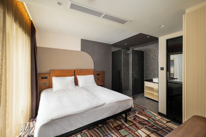 Imagen de la habitación del Hotel GIN Budapest. Foto 4