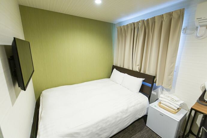 Imagen de la habitación del Hotel GLOU Higashi Shinjuku. Foto 16