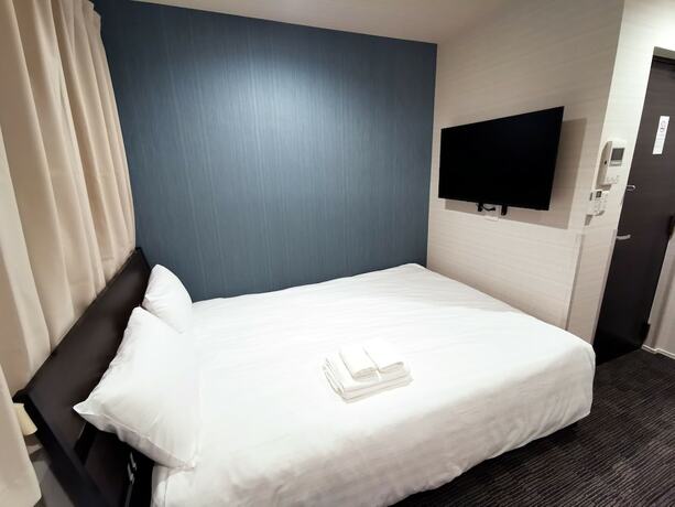 Imagen de la habitación del Hotel GLOU Higashi Shinjuku. Foto 18