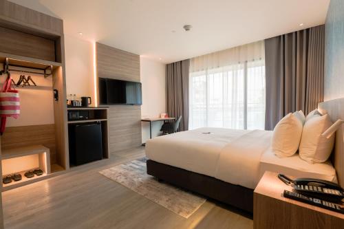 Imagen de la habitación del Hotel GLOW Bangkok Riverside. Foto 3