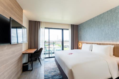 Imagen de la habitación del Hotel GLOW Bangkok Riverside. Foto 5