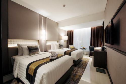 Imagen de la habitación del Hotel GRAMM by Ambarrukmo Yogyakarta. Foto 6