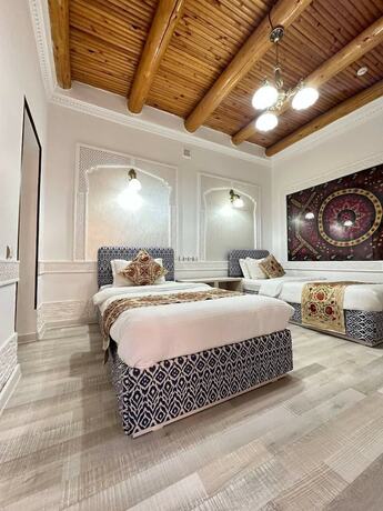 Imagen de la habitación del Hotel GRAND NODIRBEK. Foto 20