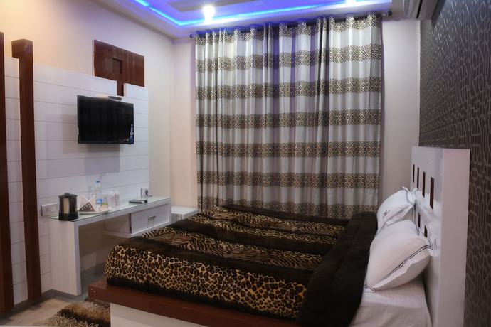 Imagen de la habitación del Hotel GST Grand Plaza. Foto 12