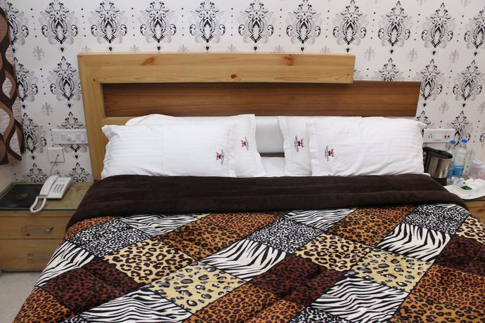 Imagen de la habitación del Hotel GST Grand Plaza. Foto 16