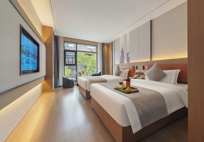 Imagen de la habitación del Hotel GUI YUAN ZHEN PIN HOTEL. Foto 8