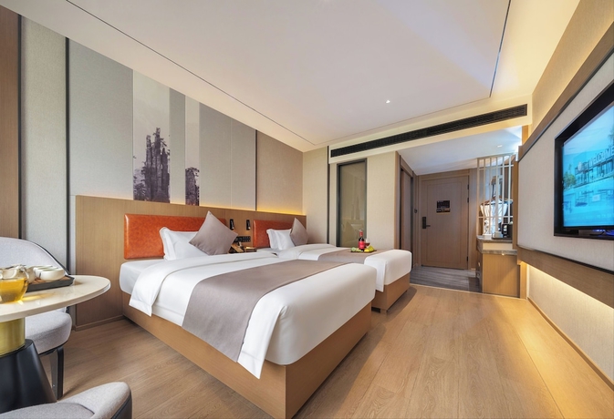 Imagen de la habitación del Hotel GUI YUAN ZHEN PIN HOTEL. Foto 12