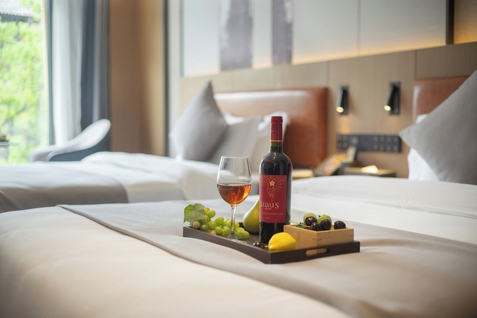 Imagen de la habitación del Hotel GUI YUAN ZHEN PIN HOTEL. Foto 13