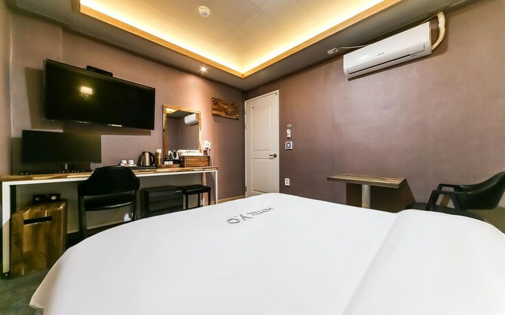 Imagen de la habitación del Hotel GUKMIN. Foto 15