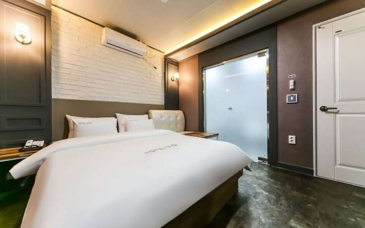 Imagen de la habitación del Hotel GUKMIN. Foto 21