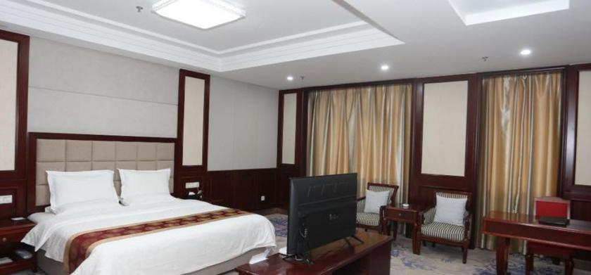Imagen de la habitación del Hotel GUOYUAN HOTEL. Foto 8
