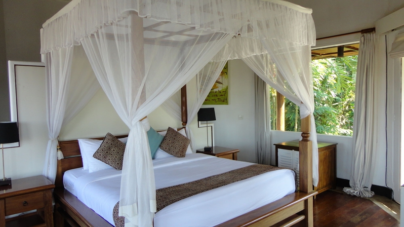 Imagen de la habitación del Hotel Gajah Biru Bungalows. Foto 6