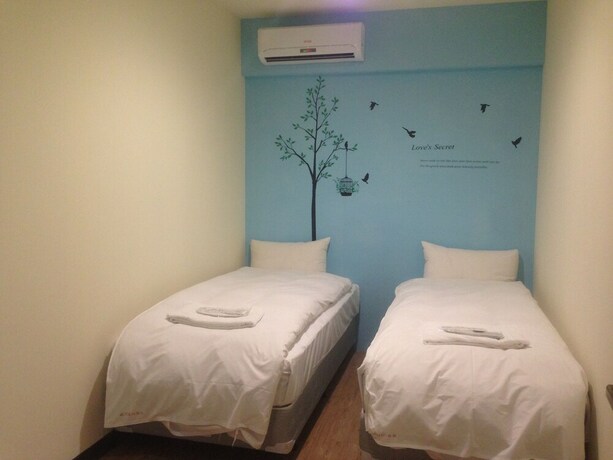 Imagen de la habitación del Hotel Galaxy Mini Inn. Foto 19