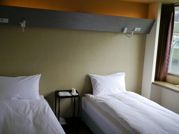 Imagen de la habitación del Hotel Galaxy Mini Inn. Foto 24
