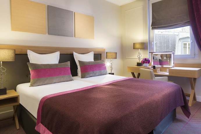 Imagen de la habitación del Hotel Galileo, París. Foto 14