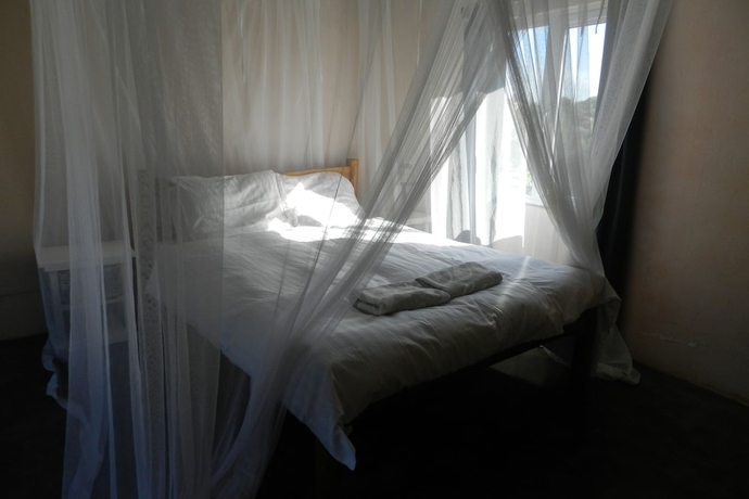 Imagen de la habitación del Hotel Gamboozini Lodge. Foto 10
