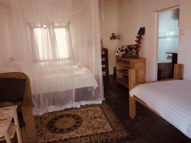 Imagen de la habitación del Hotel Gamboozini Lodge. Foto 14