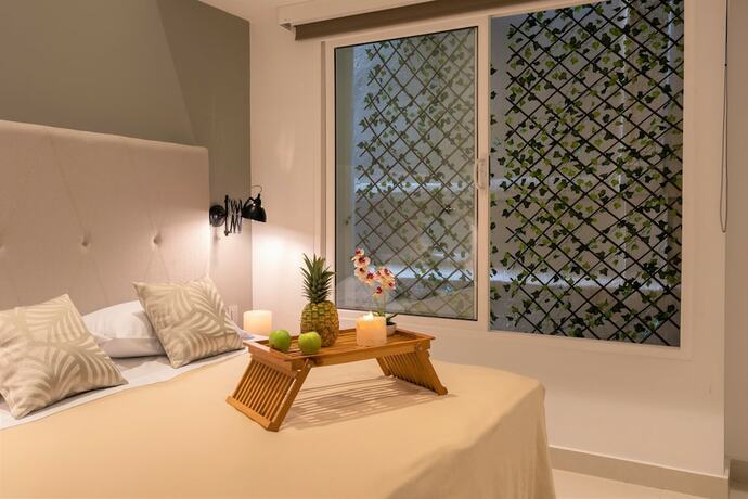 Imagen de la habitación del Hotel Ganem Lifestyle Suites. Foto 15