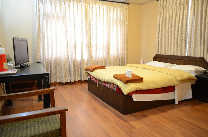 Imagen de la habitación del Hotel Ganesh Himal. Foto 2