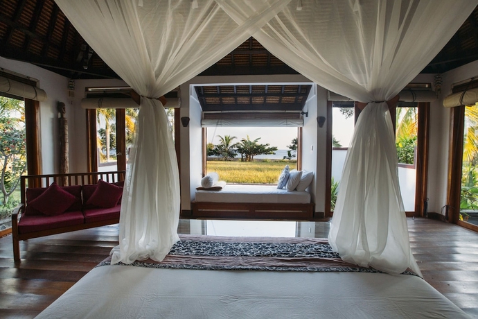 Imagen de la habitación del Hotel Ganesha Bali Coral Reef Villas. Foto 2