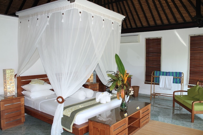 Imagen de la habitación del Hotel Ganesha Bali Coral Reef Villas. Foto 5