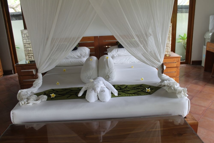 Imagen de la habitación del Hotel Ganesha Bali Coral Reef Villas. Foto 6