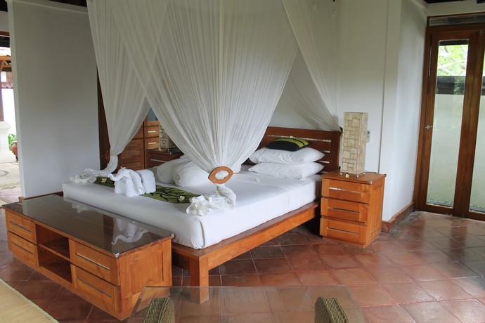 Imagen de la habitación del Hotel Ganesha Bali Coral Reef Villas. Foto 7