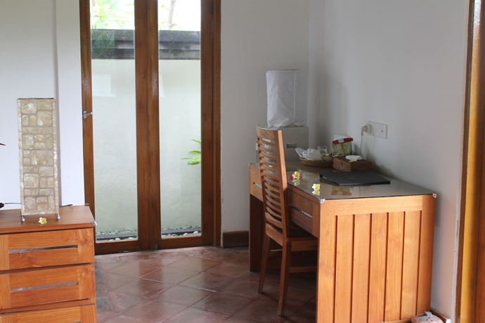 Imagen de la habitación del Hotel Ganesha Bali Coral Reef Villas. Foto 8