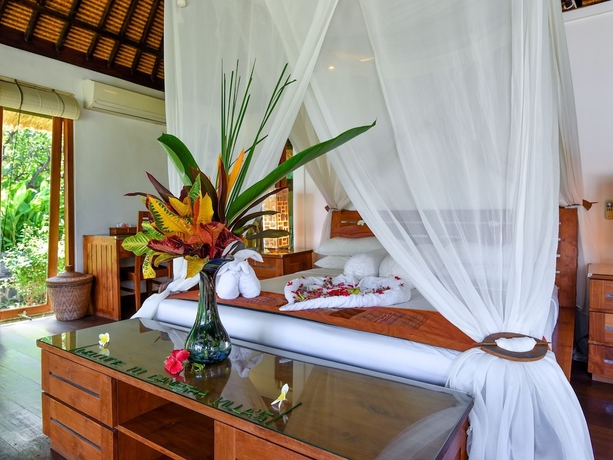 Imagen de la habitación del Hotel Ganesha Bali Coral Reef Villas. Foto 10