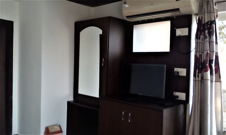 Imagen de la habitación del Hotel Ganesha Inn Ganga View. Foto 1