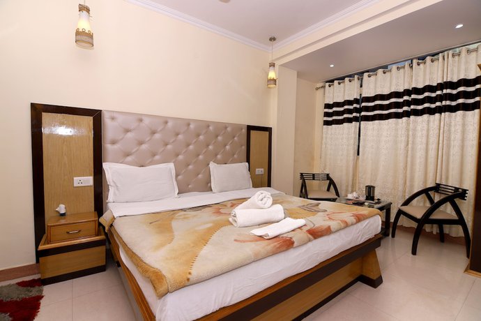 Imagen de la habitación del Hotel Ganesha Inn Ganga View. Foto 5