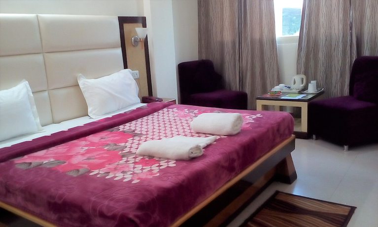 Imagen de la habitación del Hotel Ganesha Inn Ganga View. Foto 11