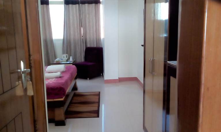 Imagen de la habitación del Hotel Ganesha Inn Ganga View. Foto 12