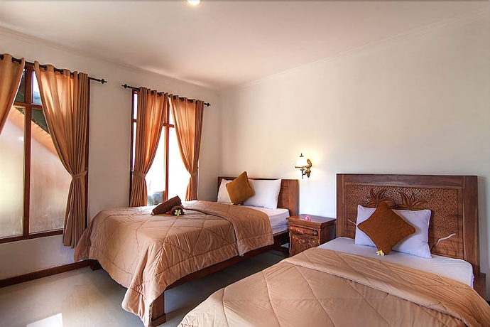 Imagen de la habitación del Hotel Ganesha Ubud Inn. Foto 2