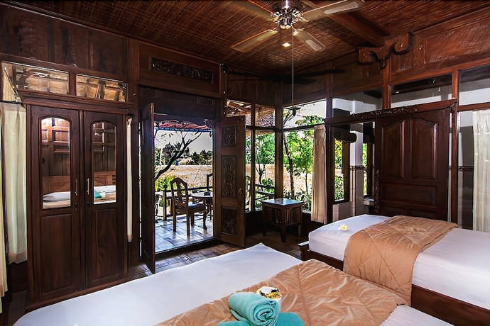 Imagen de la habitación del Hotel Ganesha Ubud Inn. Foto 5