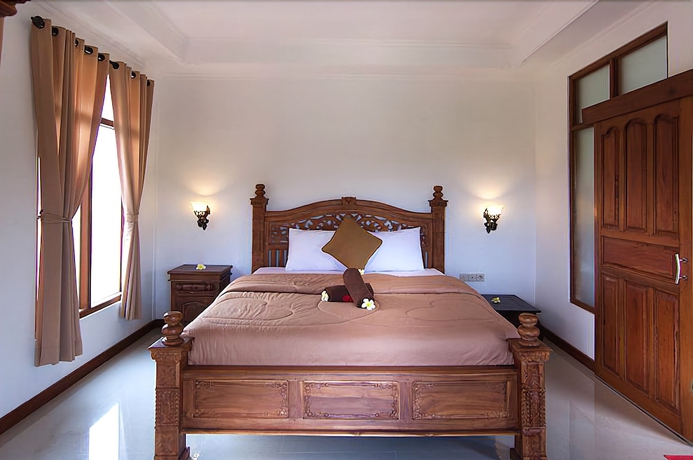 Imagen de la habitación del Hotel Ganesha Ubud Inn. Foto 6