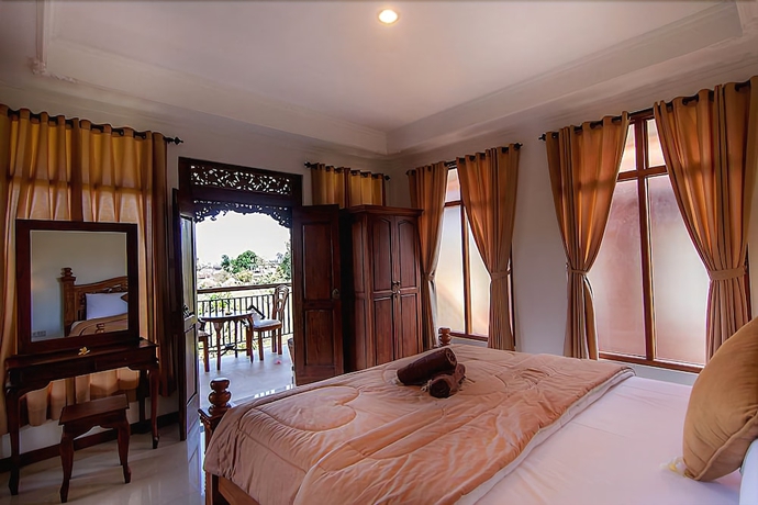 Imagen de la habitación del Hotel Ganesha Ubud Inn. Foto 7
