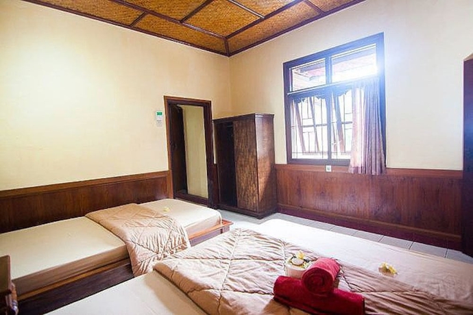 Imagen de la habitación del Hotel Ganesha Ubud Inn. Foto 12