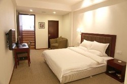 Imagen de la habitación del Hotel GangWan Business. Foto 16