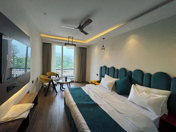 Imagen de la habitación del Hotel Ganga Aamantran. Foto 6