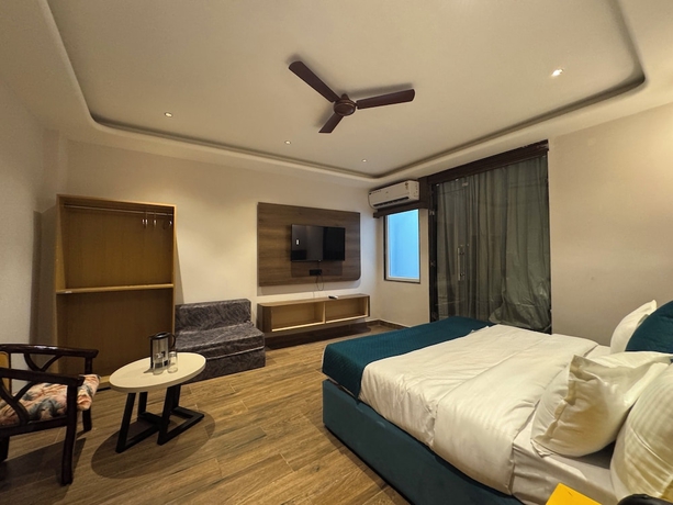 Imagen de la habitación del Hotel Ganga Aamantran. Foto 12