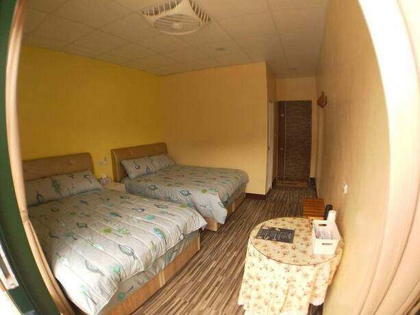Imagen de la habitación del Hotel Ganghao. Foto 15