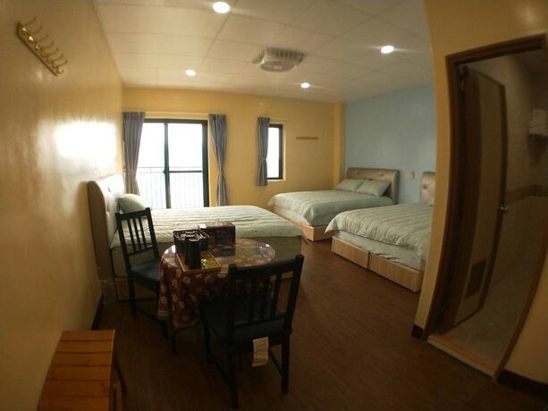 Imagen de la habitación del Hotel Ganghao. Foto 19