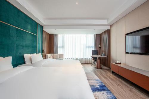 Imagen de la habitación del Hotel Gao Shi Di Hot Spring Yangzhou. Foto 19