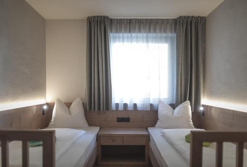 Imagen de la habitación del Hotel Garberhof Dolomit Family. Foto 7